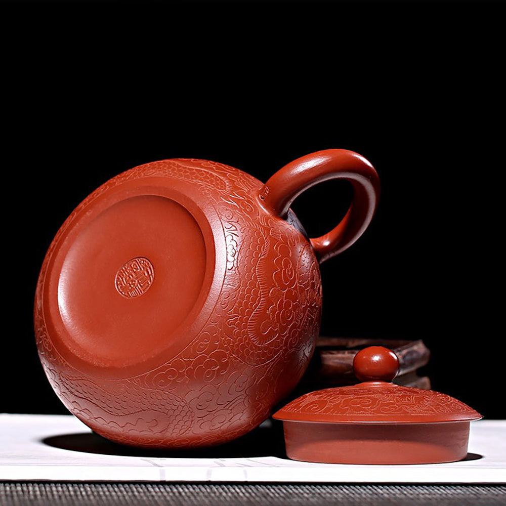 Dahongpao Yixing teapot showcasing intricate dragon designs from a side view.