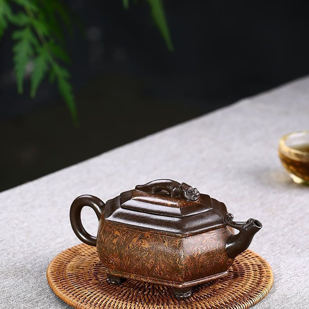 Artisan Chilong Dragon Motif Teapot displayed in a serene tea setting, highlighting its elegant design.