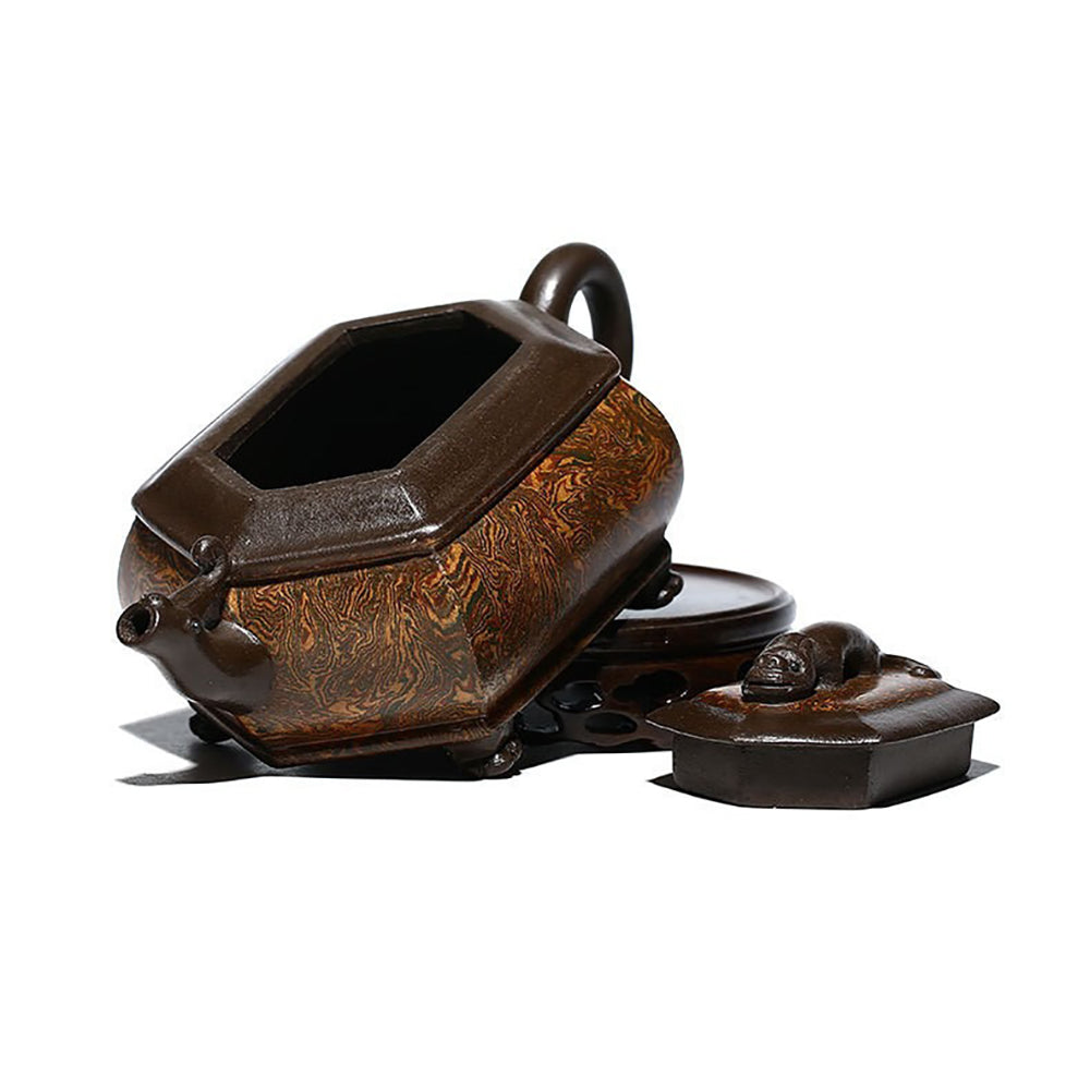 Artisan Chilong Dragon Motif Teapot displayed in a serene tea setting, highlighting its elegant design.