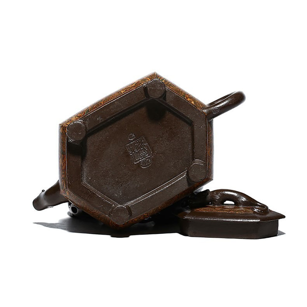 Side view of the Artisan Chilong Dragon Motif Teapot, emphasizing its unique spout and handle.