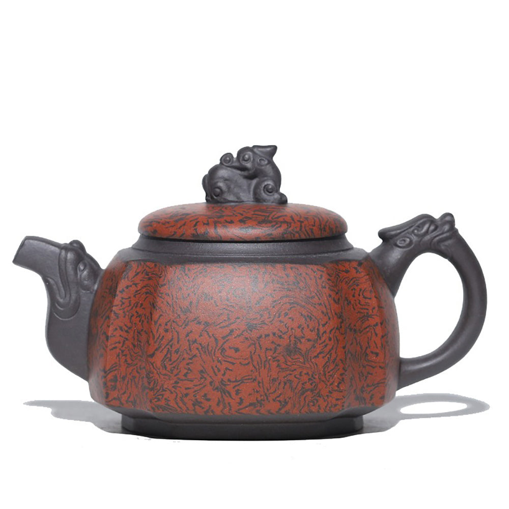 Handmade purple clay teapot with dragon motifs, front angle