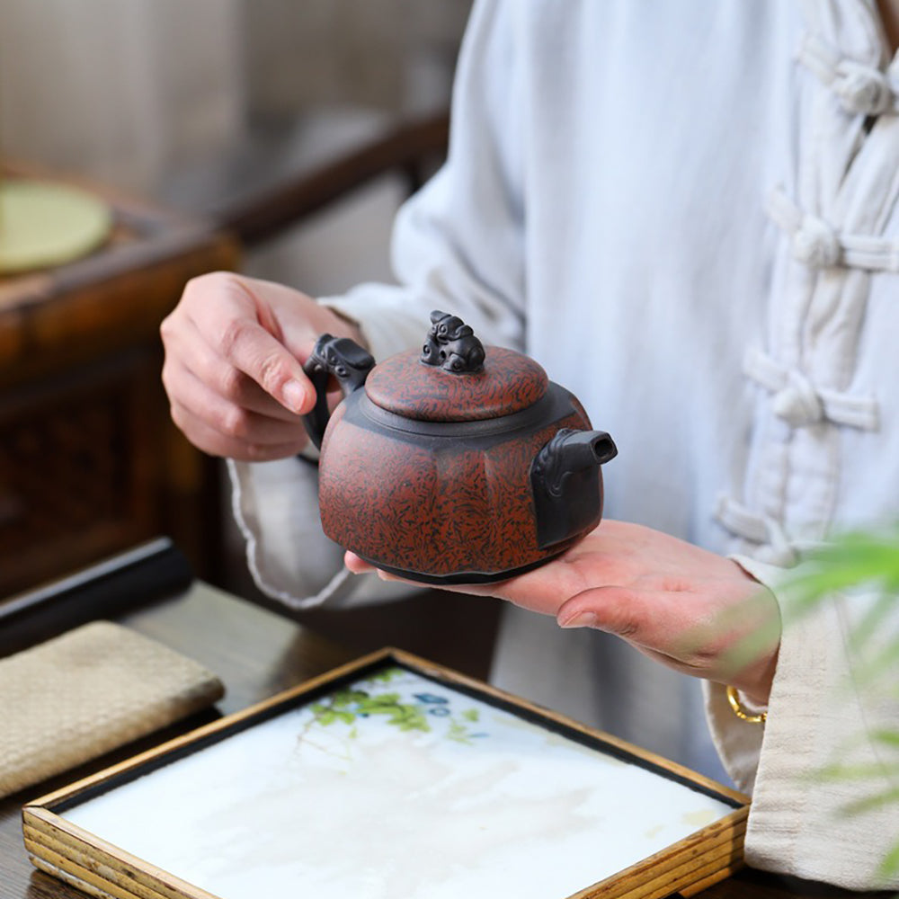 Close-up of the twisting mud technique on a Yixing purple clay teapot
