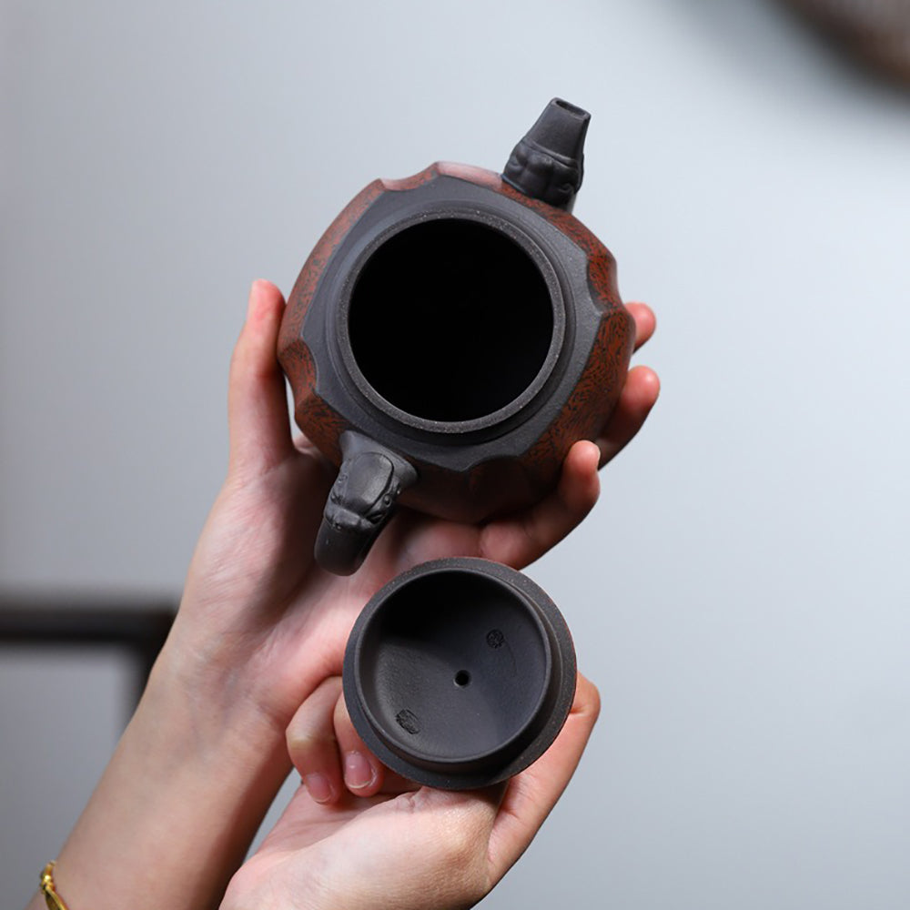 Close-up of the twisting mud technique on a Yixing purple clay teapot