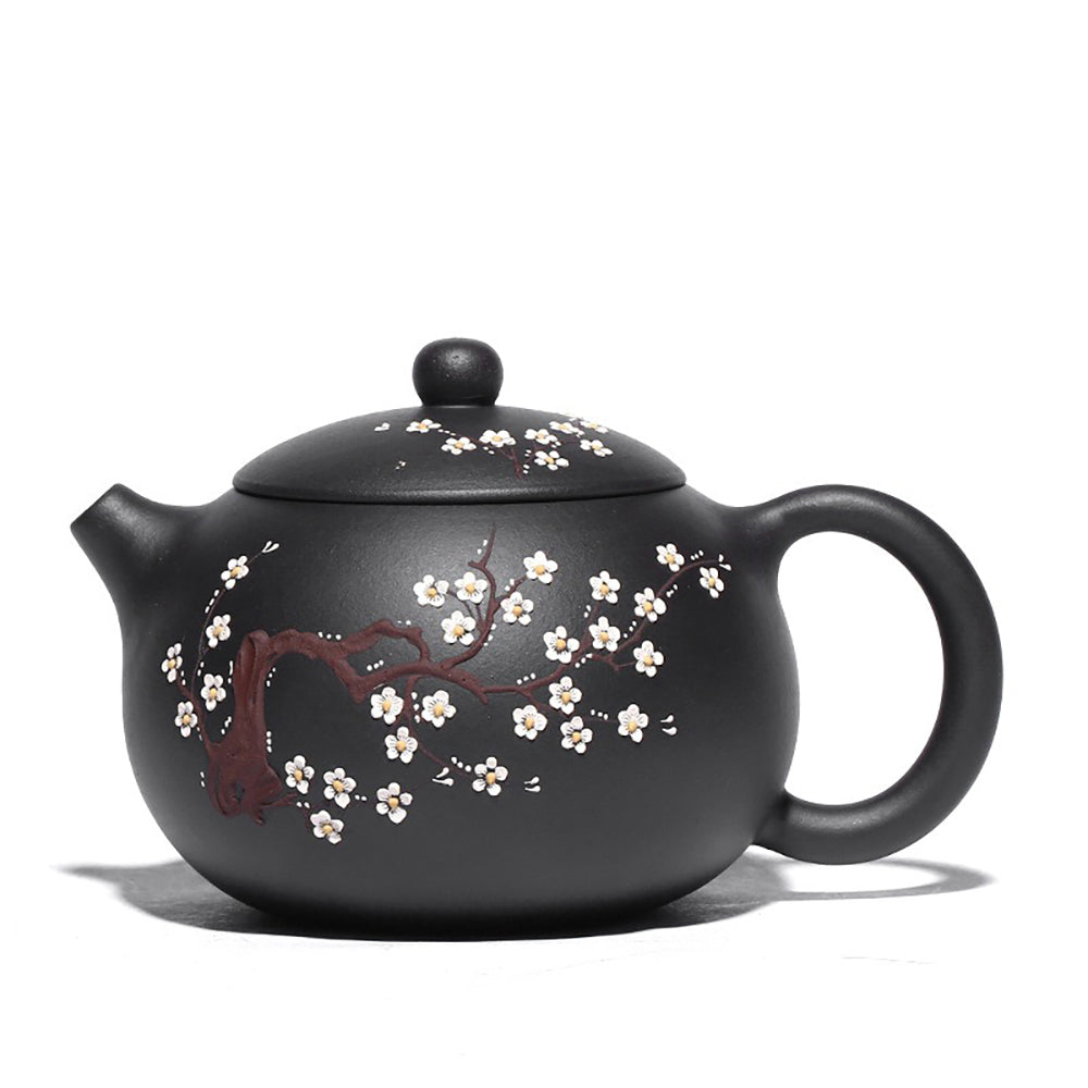 Plum Blossom Yixing Black Clay Teapot from a side view, showcasing its elegant design and craftsmanship.