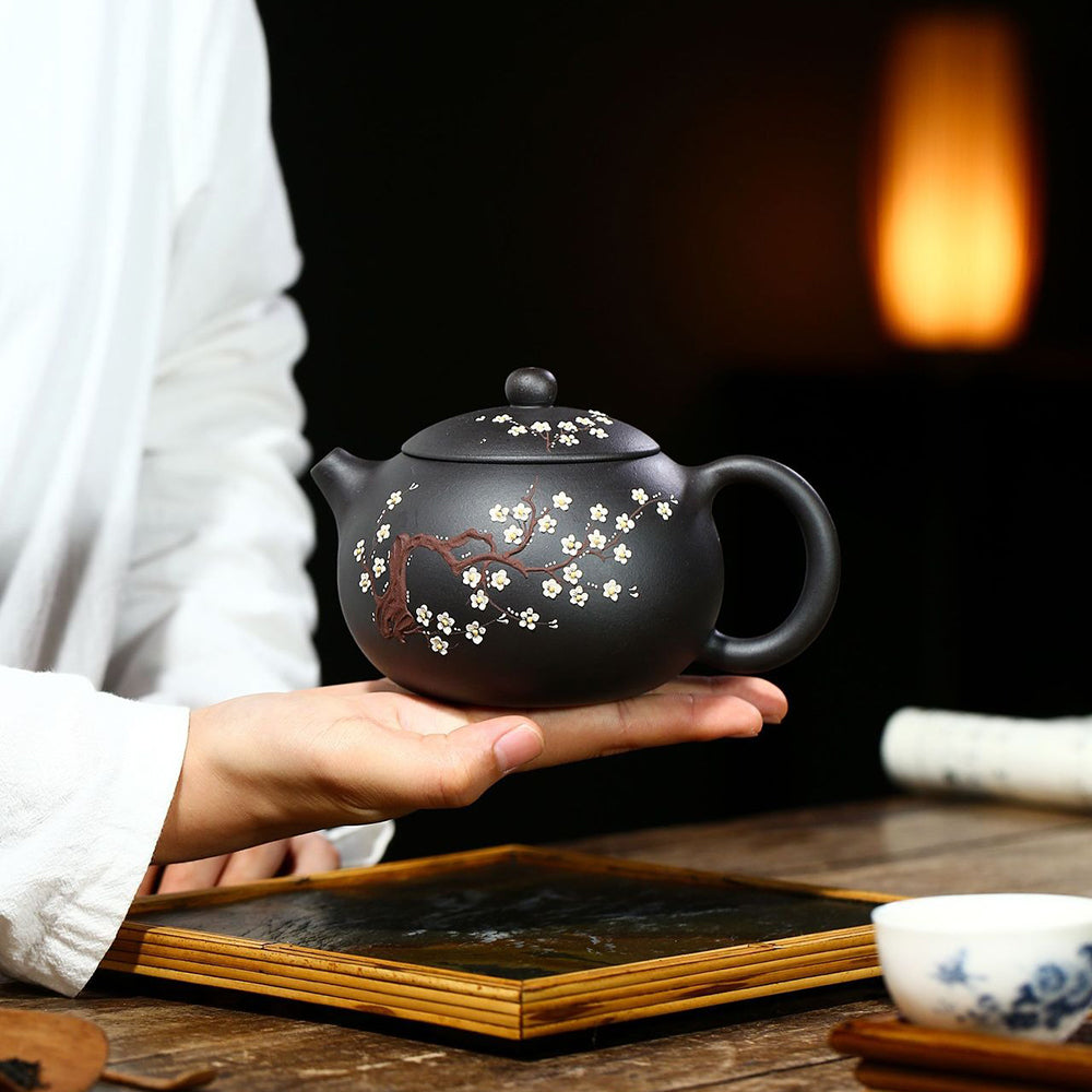 Aerial view of the Yixing black clay teapot filled with brewed tea, highlighting its usability and aesthetic appeal.