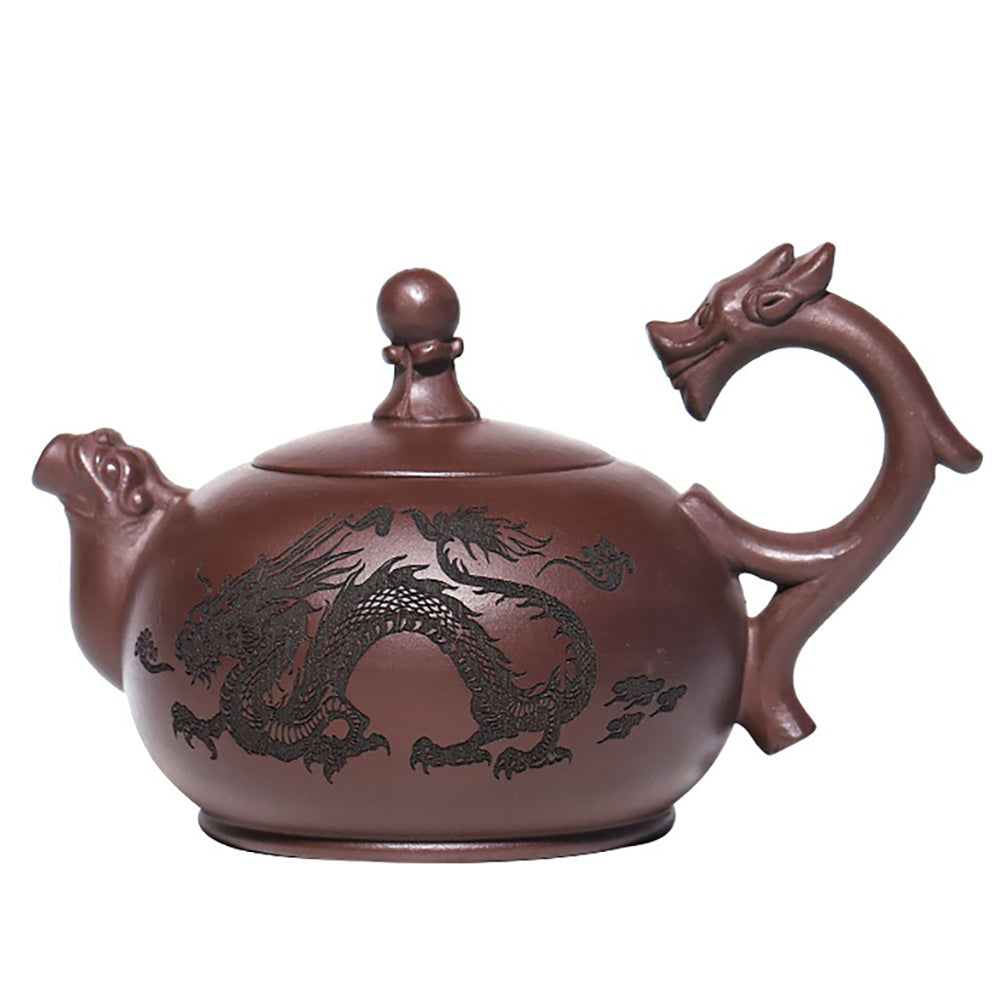 Detailed view of the Yixing double dragons playing with beads teapot highlighting dragon motifs