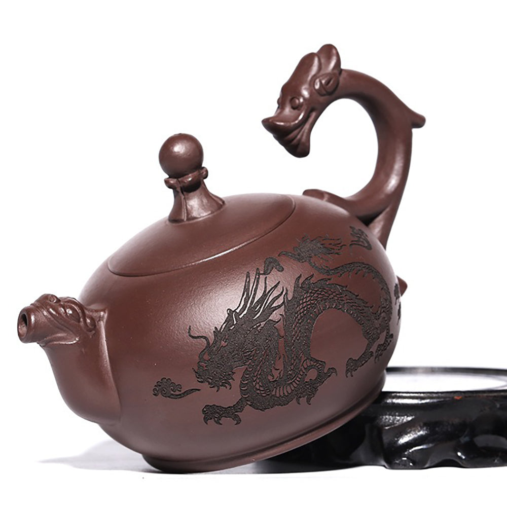 Side angle of the ceramic teapot showcasing the handle and spout designed as dragons