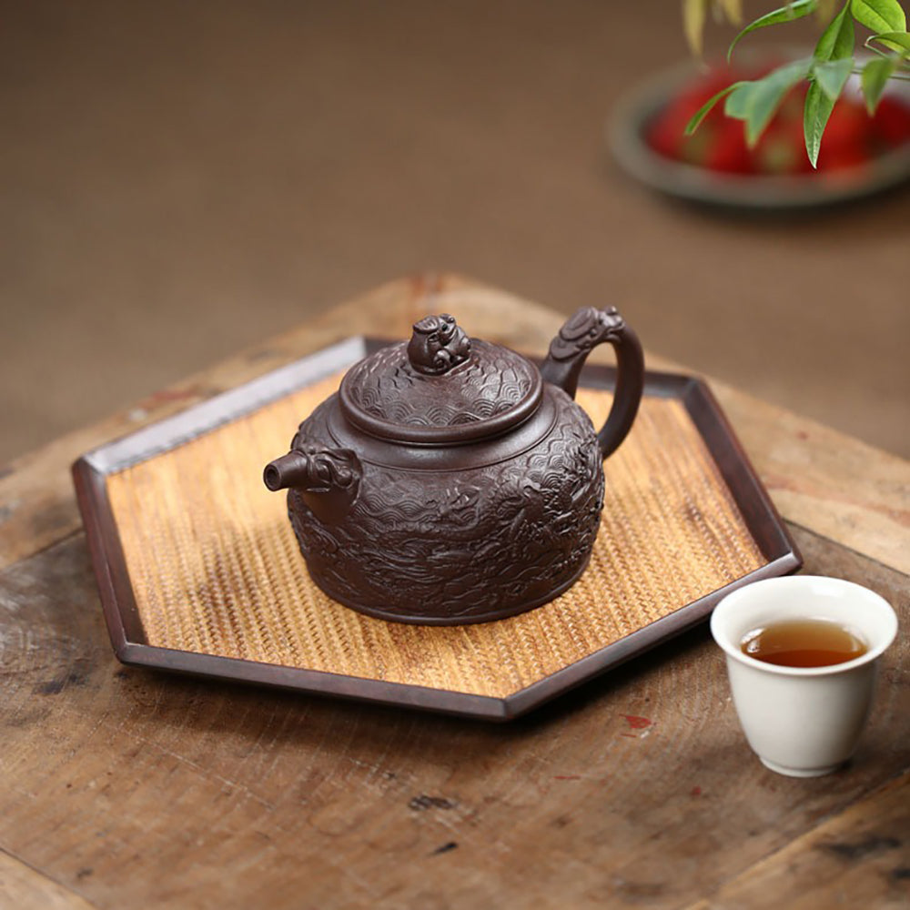 Side view of handcrafted dragon-shaped handle and spout on Yixing teapot
