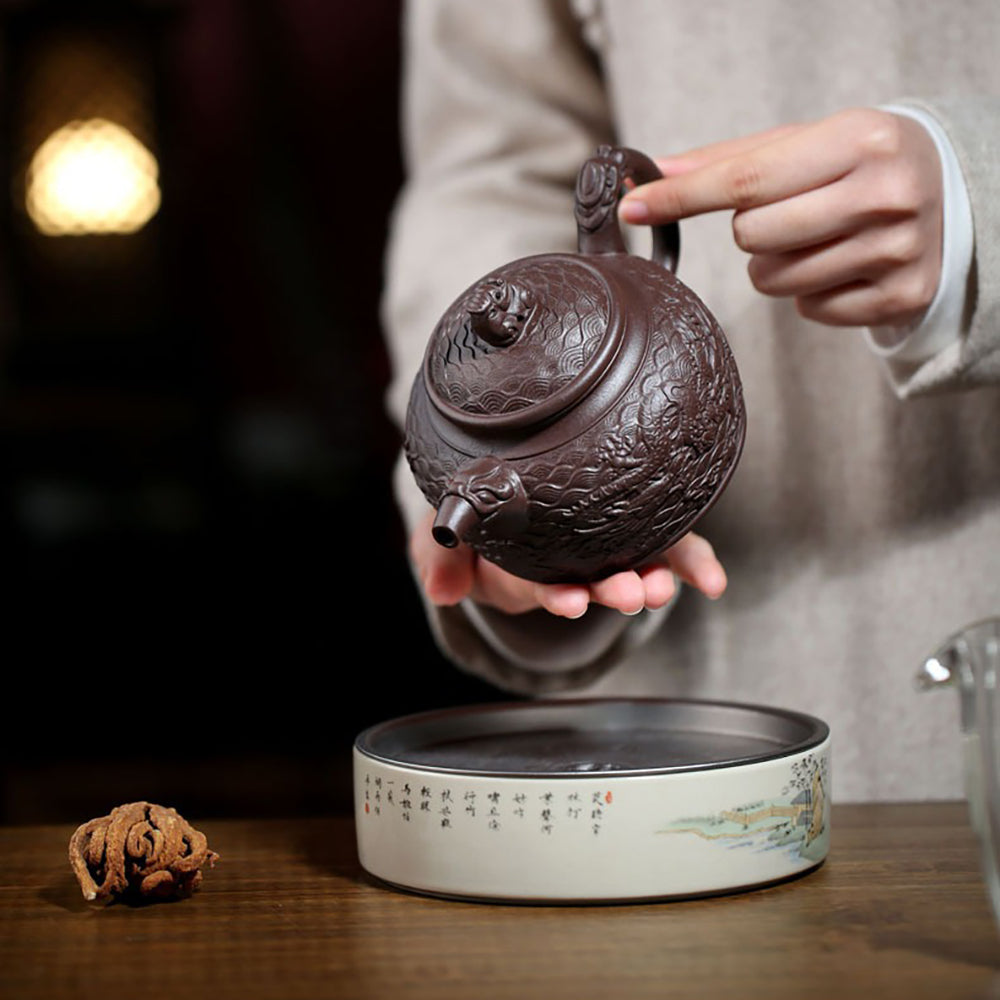 Elegant purple clay teapot with dragon lid button and intricate design