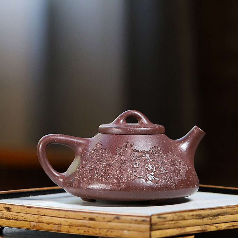 Side angle of the purple clay teapot with a smooth finish, demonstrating its unique triangular shape.