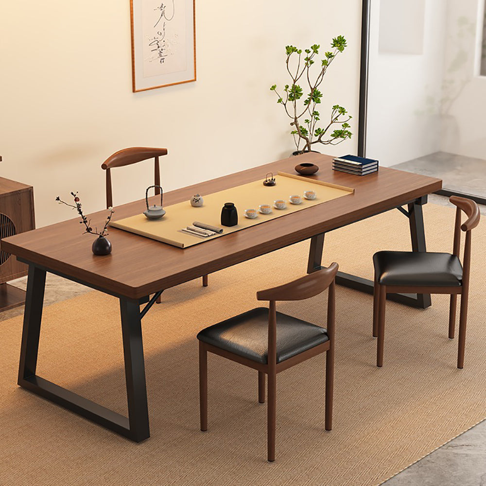 Angled view of the steel-wood tea table with chairs, showcasing walnut finish and sturdy frame