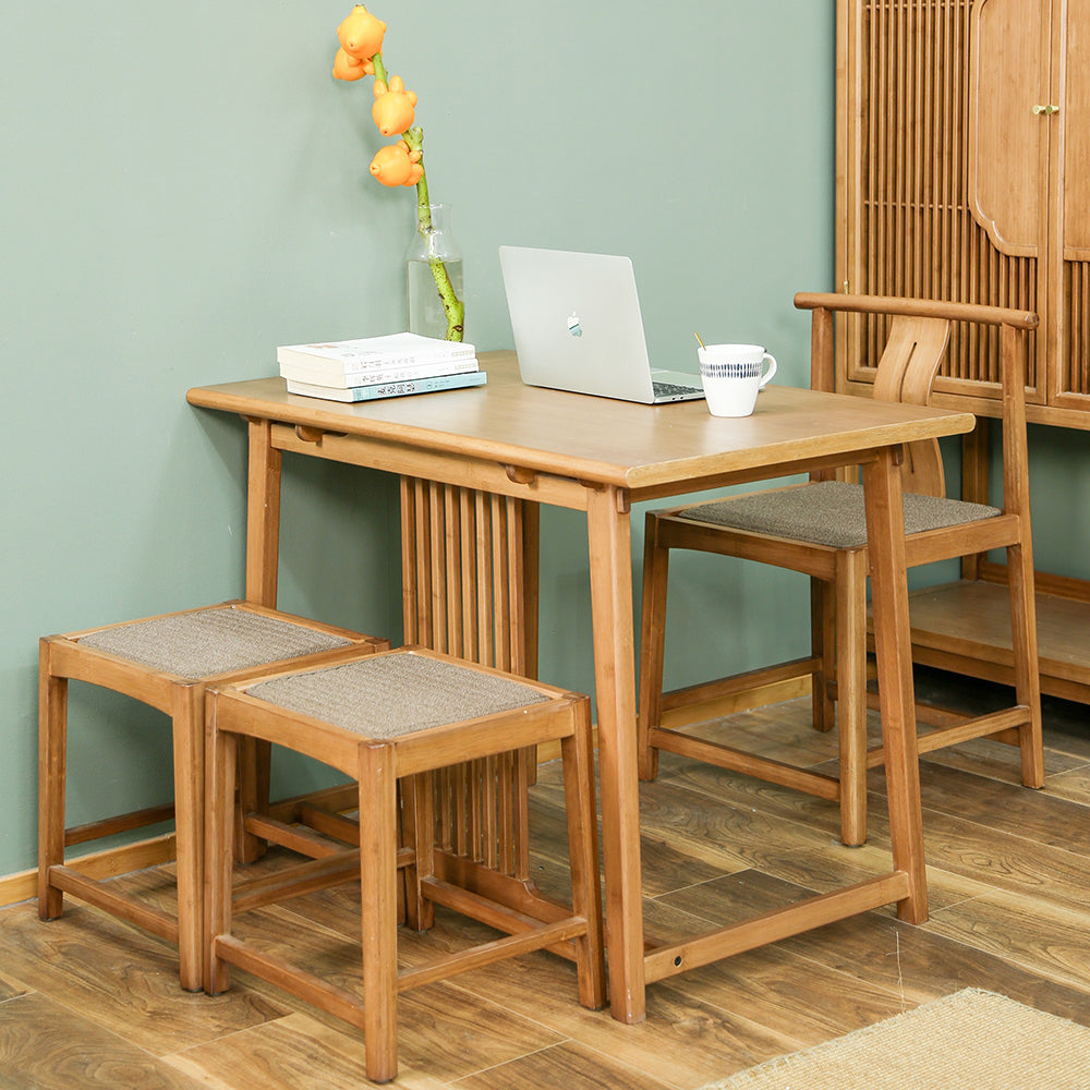 Elegant bamboo tea table set with three chairs, showing its modern design