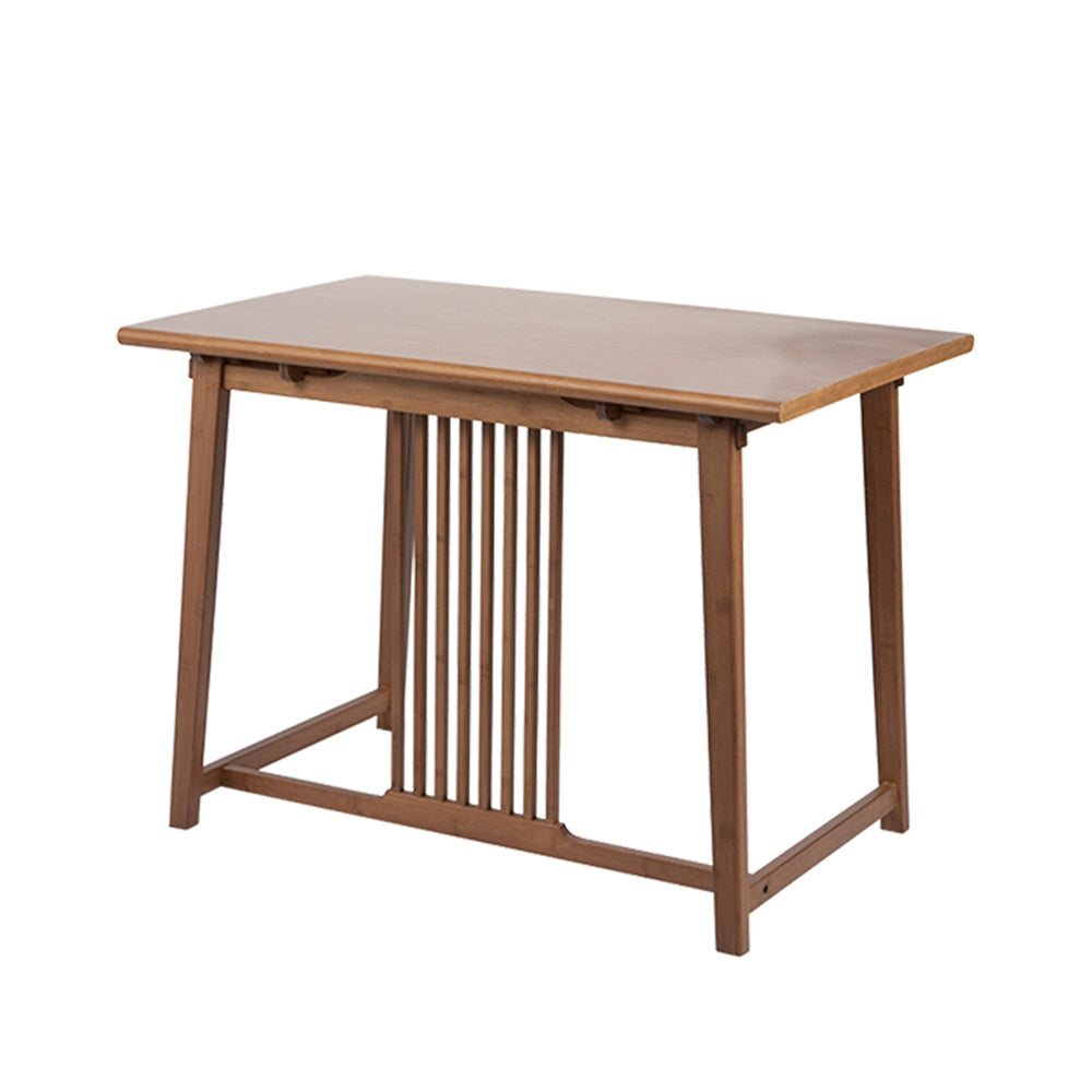 Cozy tea setup with the bamboo tea table in a warm living room setting