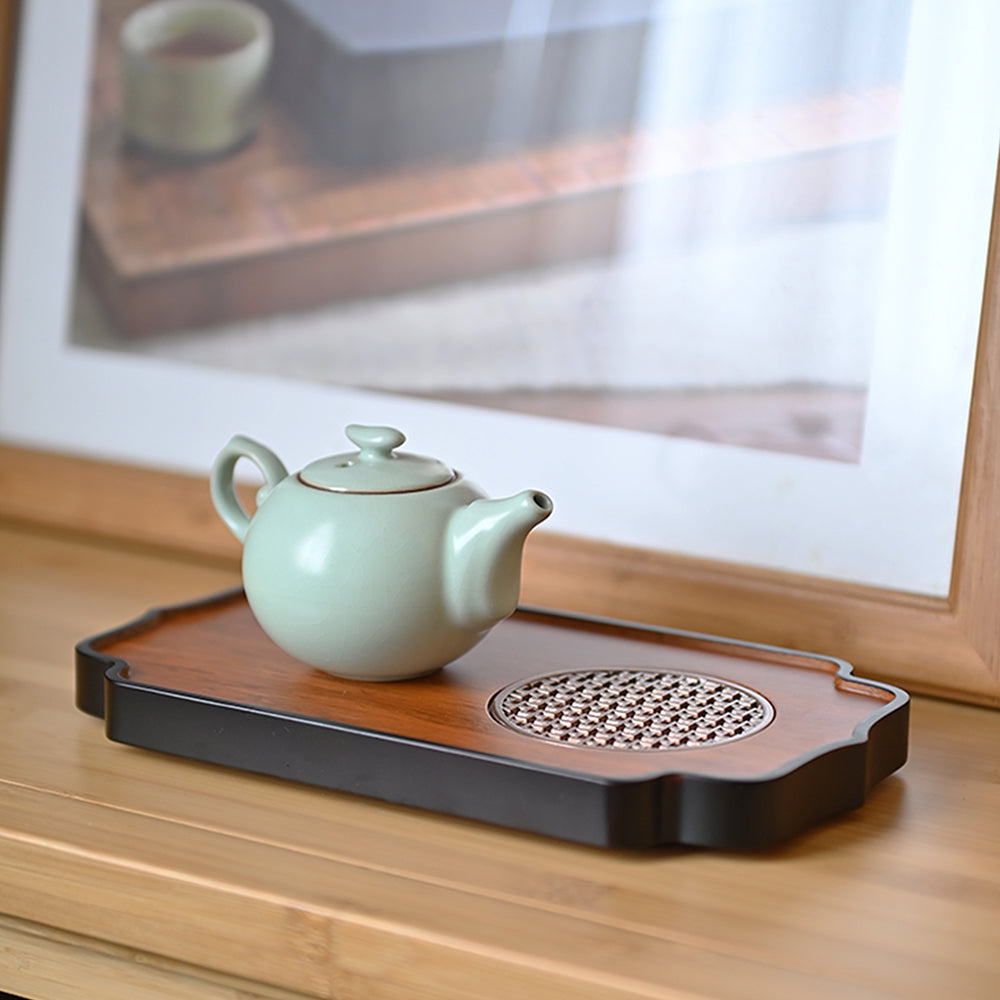 Bamboo and metal tea tray showcasing artistic hollow window pattern