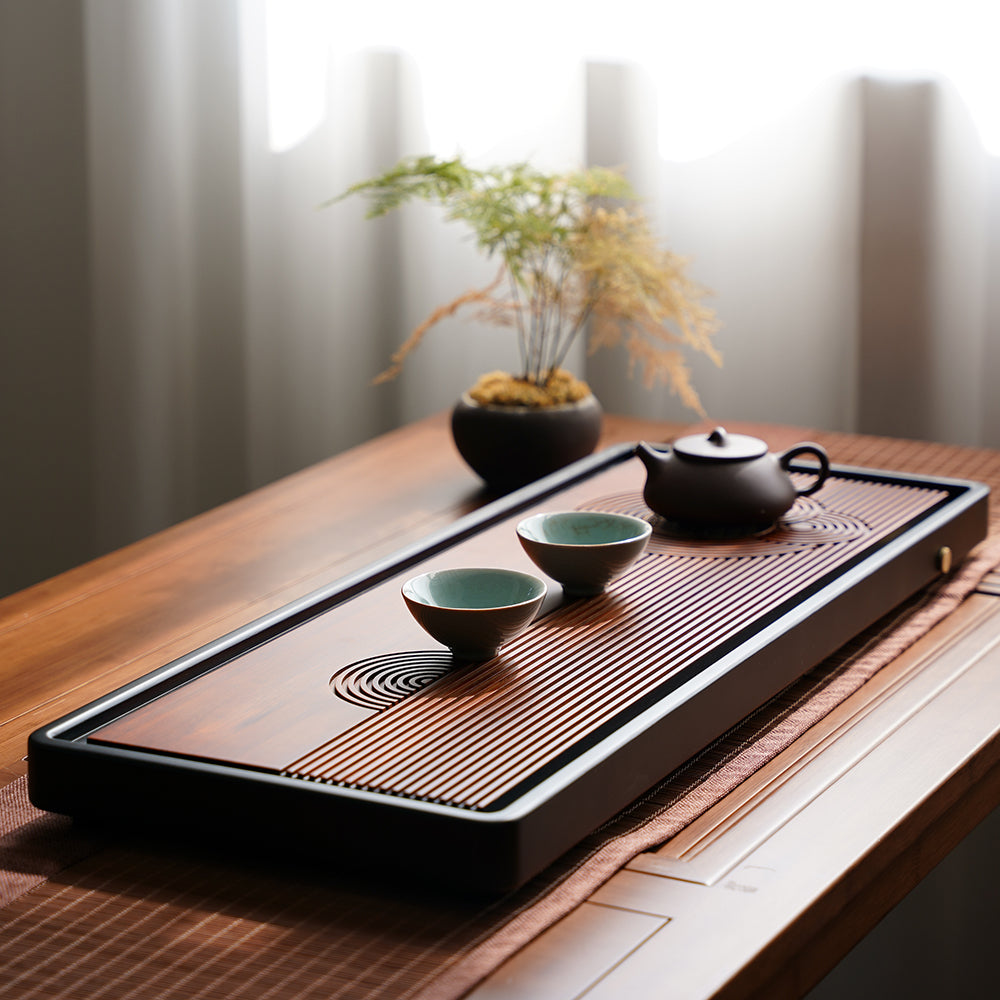 Bamboo tea tray with brass knob and water flow control for tea brewing