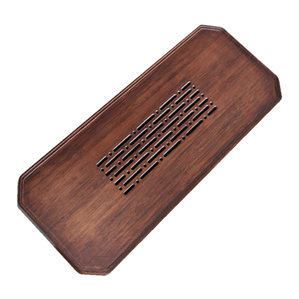 Close-up of ocean-inspired engraved patterns on bamboo gongfu tea tray