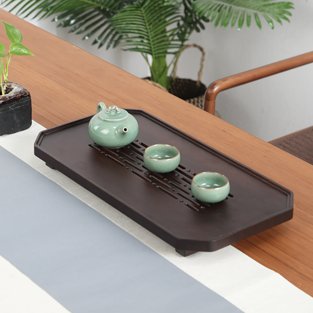 Elegant bamboo gongfu tea tray with wave design in a serene tea room