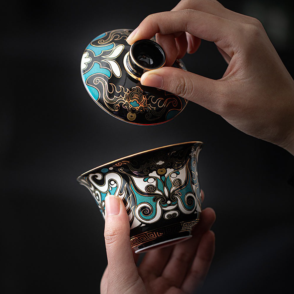 Lianpu Porcelain Gaiwan displayed with traditional Chinese tea utensils.