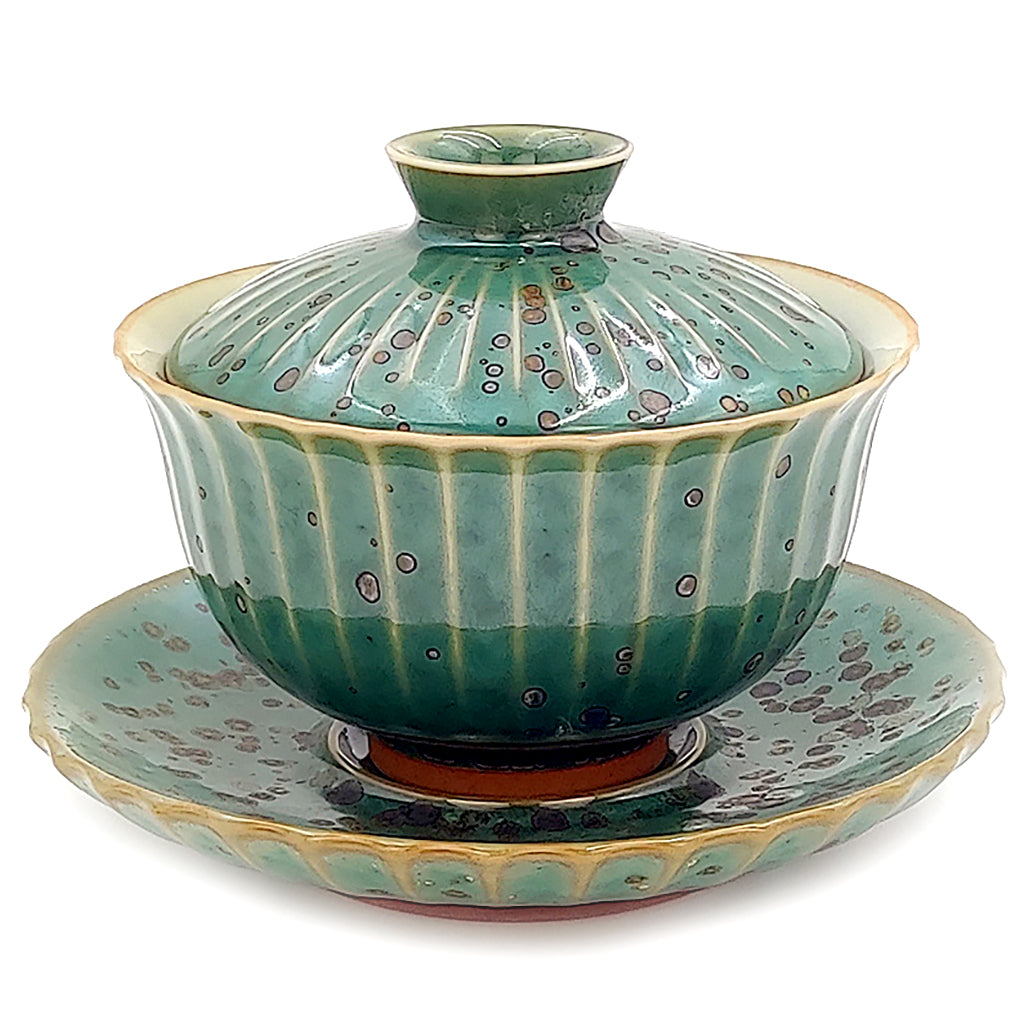 Petal-shaped Japanese gaiwan with kiln-transformed glaze showcasing crystalline patterns