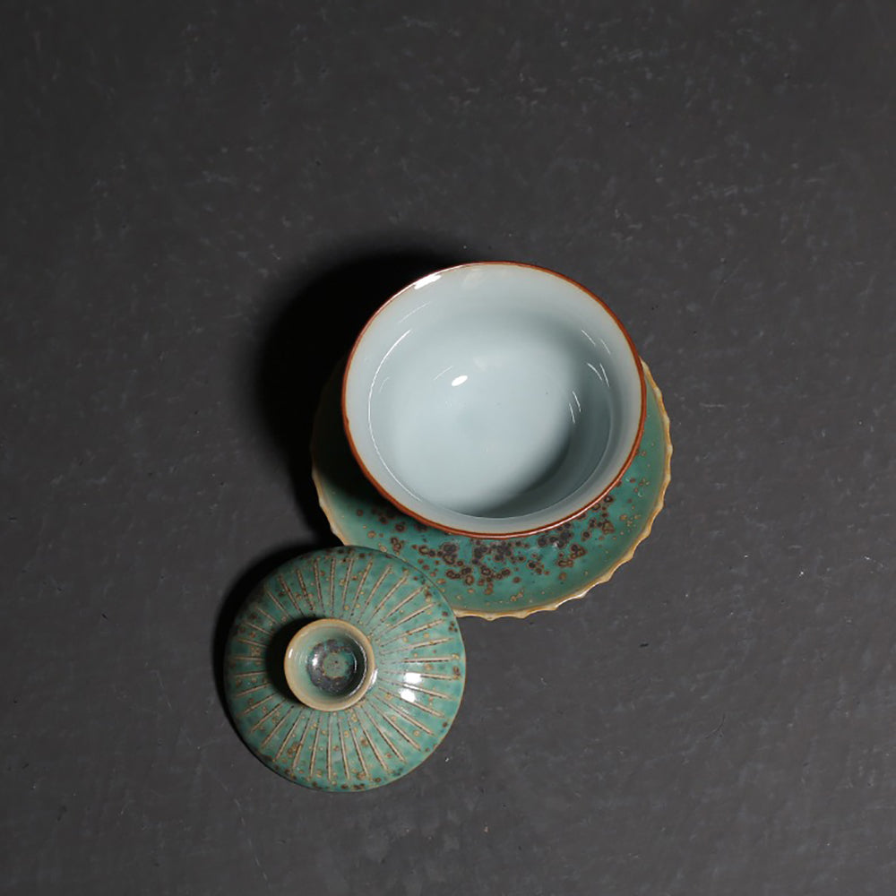 Japanese tea ware featuring a blooming flower petal design and unique glaze effects