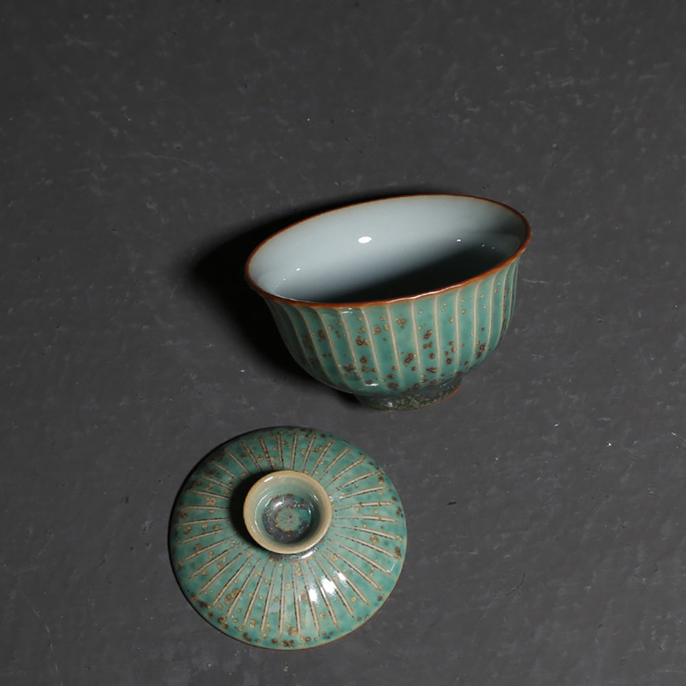 Japanese tea ware featuring a blooming flower petal design and unique glaze effects