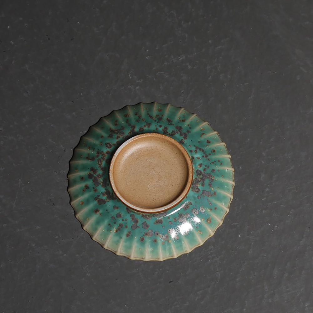 Petal-shaped Japanese gaiwan with kiln-transformed glaze showcasing crystalline patterns