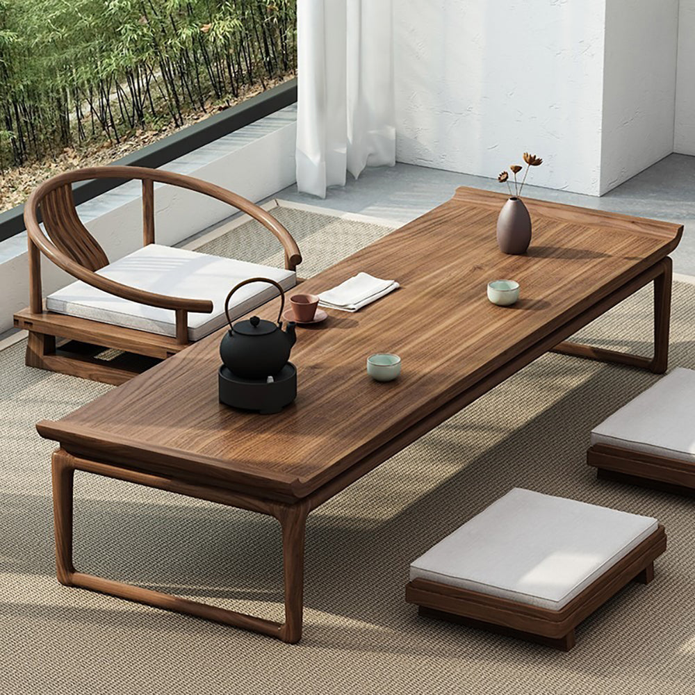 Elegant Japanese tea table set with tatami cushions, perfect for cozy dining.