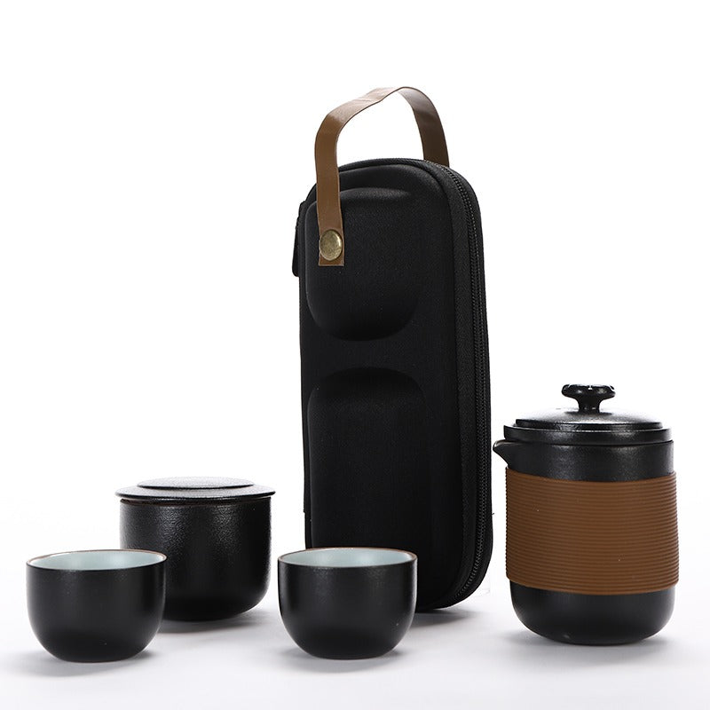 Ceramic tea set for office use, highlighting the chic black design and travel-friendly features.