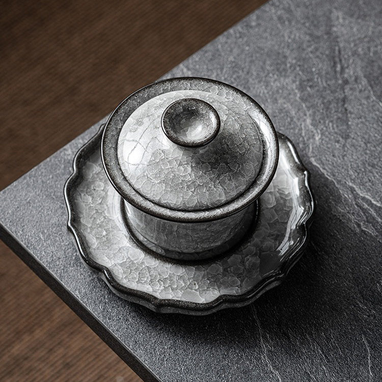 Side view of the Ru Kiln crackle glaze gaiwan with lotus-shaped base