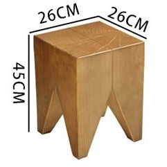 Full view of the Mediterranean raw wood tea table set in a cozy living room with chairs and a cast iron tea tray.