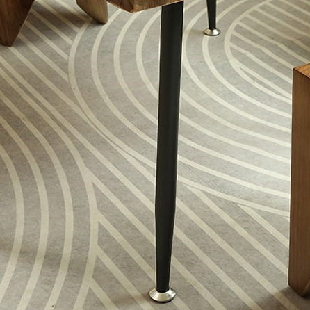 Close-up of a minimalist natural wood tea table with chairs, highlighting the smooth finish and simple design.