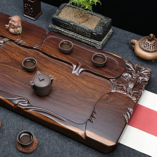 Side angle of the tea tray placed in a tea room setting with teacups