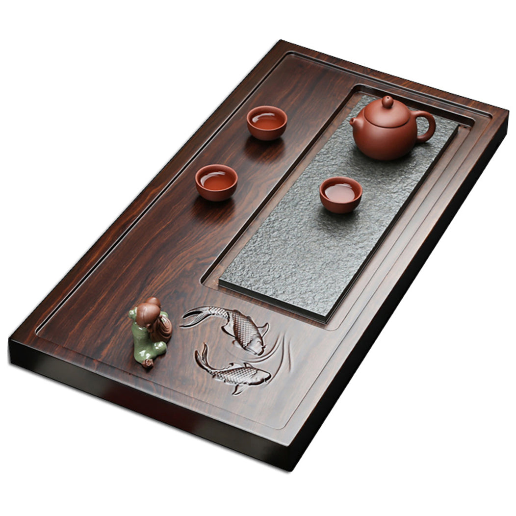 Tea tray with teapot and cups arranged for a traditional tea ceremony