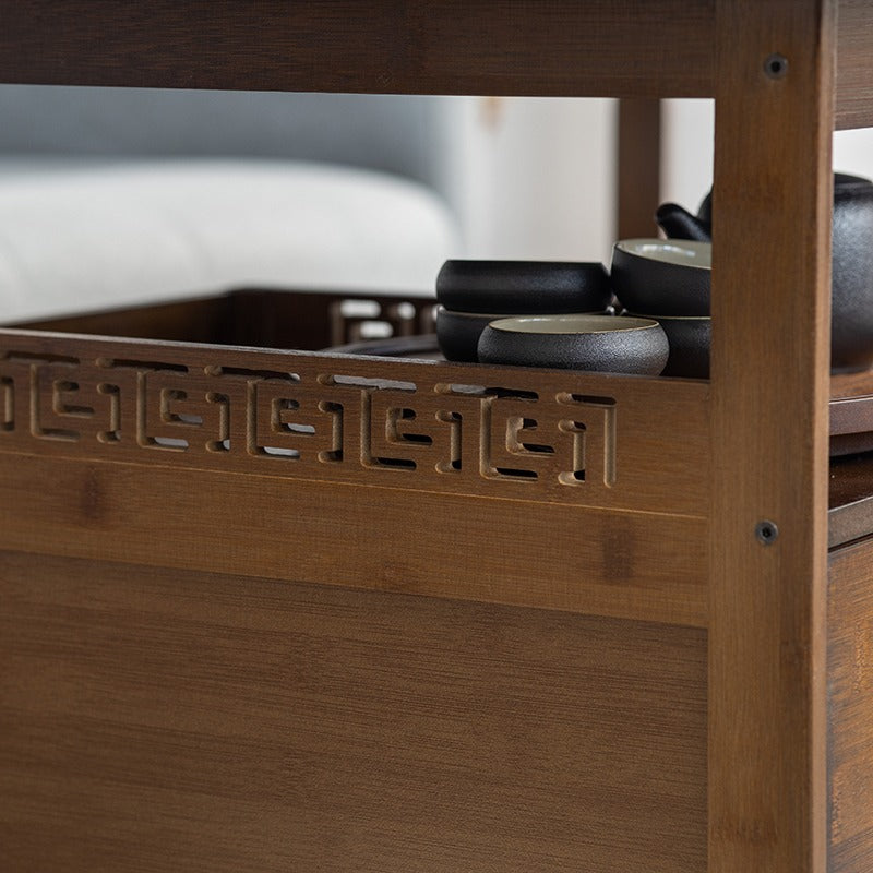 Close-up of bamboo tea table with waterproof tray and Chinese-style patterns