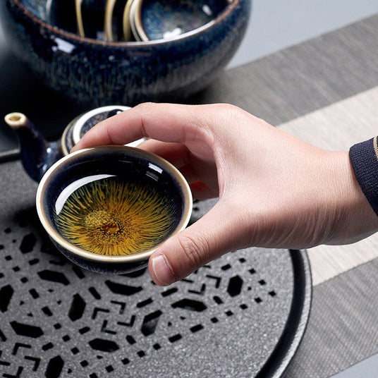 Close-up of Tianmu glaze patterns on a ceramic tea set