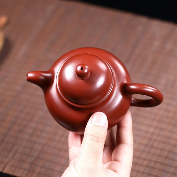 Close-up of the unique texture of the Yixing red clay teapot, emphasizing its high-quality material.