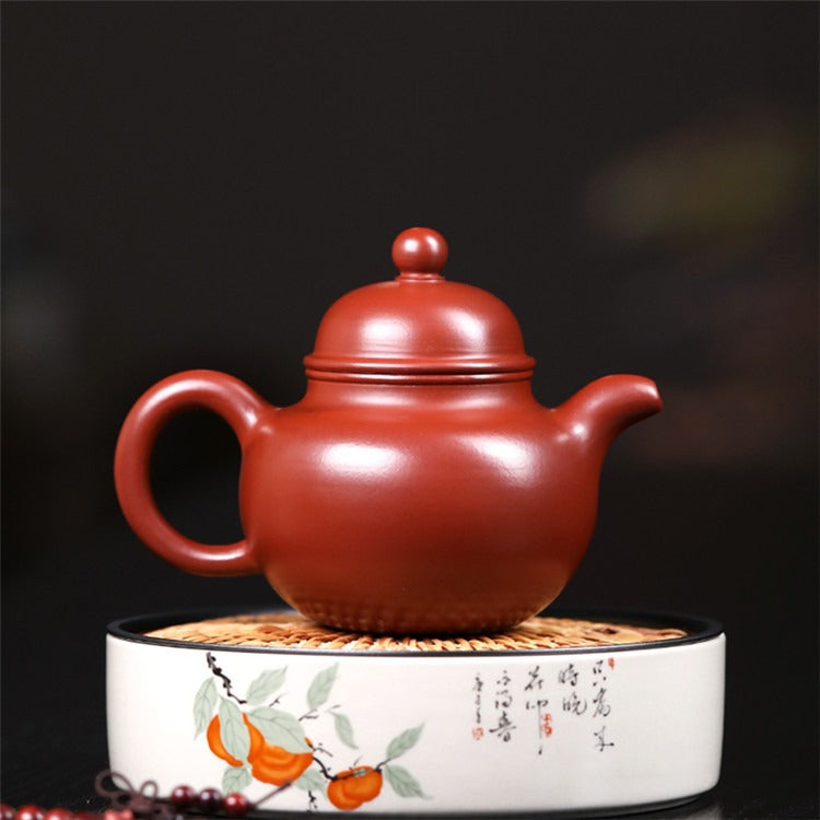Close-up of the unique texture of the Yixing red clay teapot, emphasizing its high-quality material.