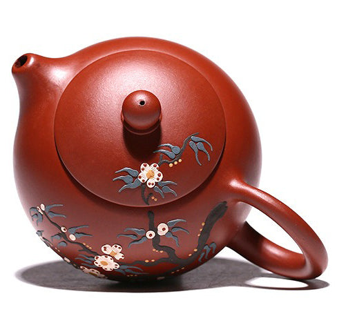 Elegant purple clay teapot filled with tea, highlighting its artistic craftsmanship.