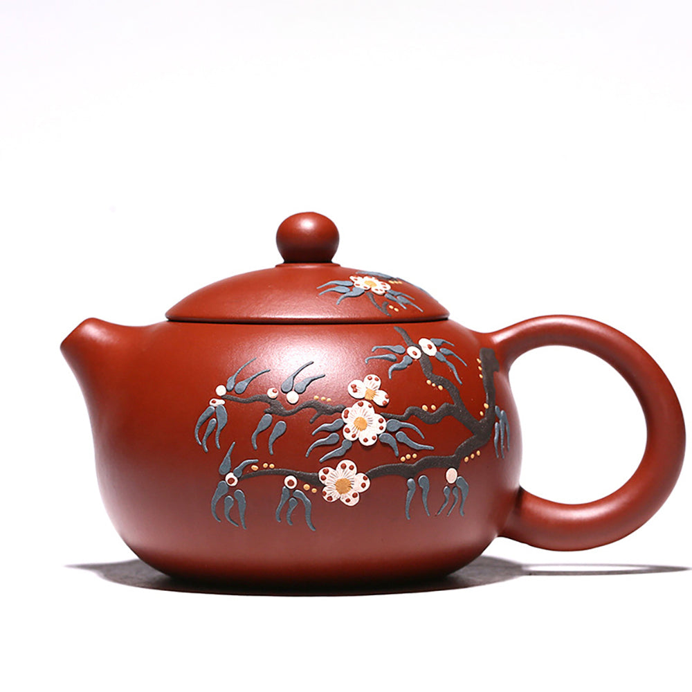 Exquisite peach blossom teapot showcasing intricate details from the side view.