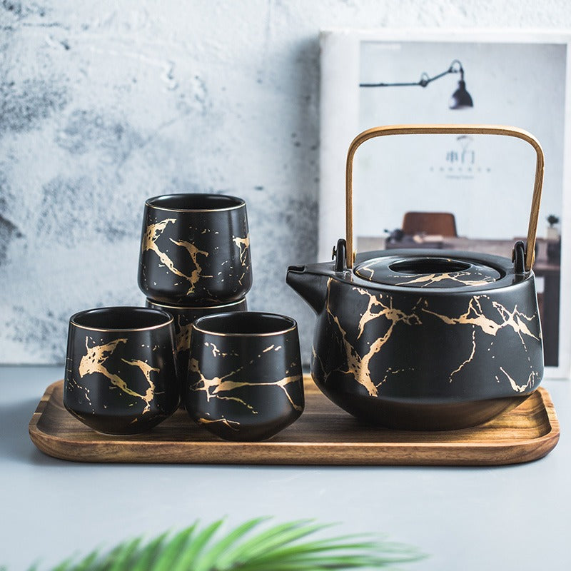 Front view of the Stone Stripes Modern Tea Set with marble and wooden accents