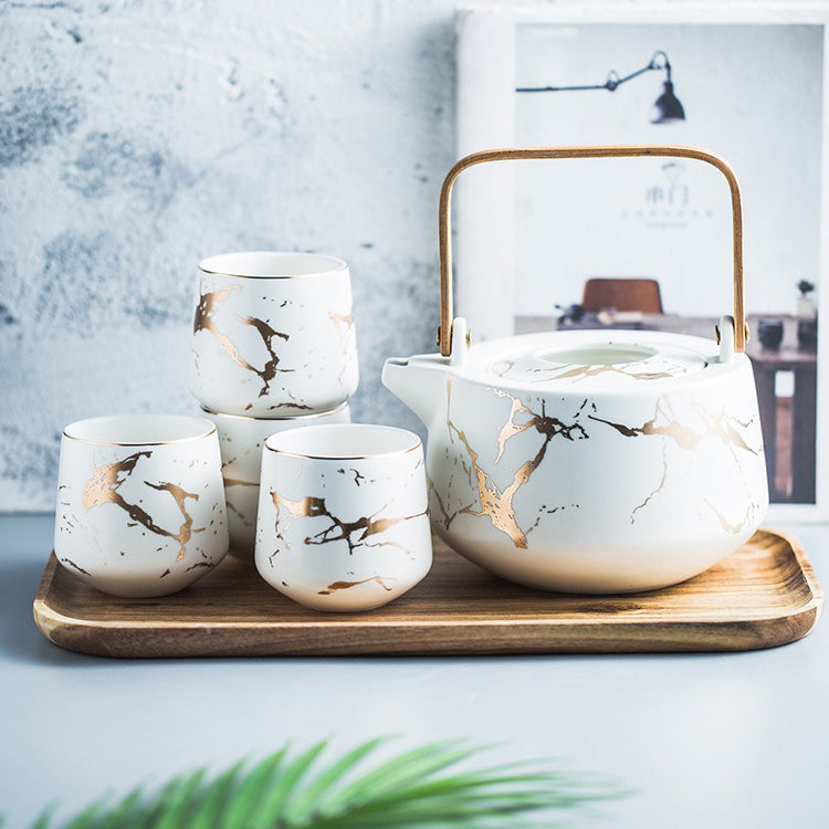 Front view of the Stone Stripes Modern Tea Set with marble and wooden accents