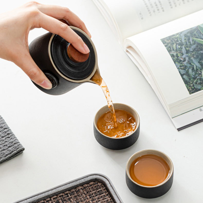 Lucky Character travel tea set displayed outdoors on a picnic blanket, perfect for nature lovers