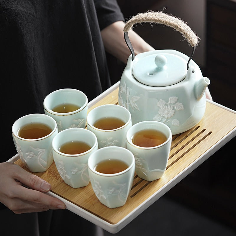 Close-up of the porcelain teapot with a smooth round spout.