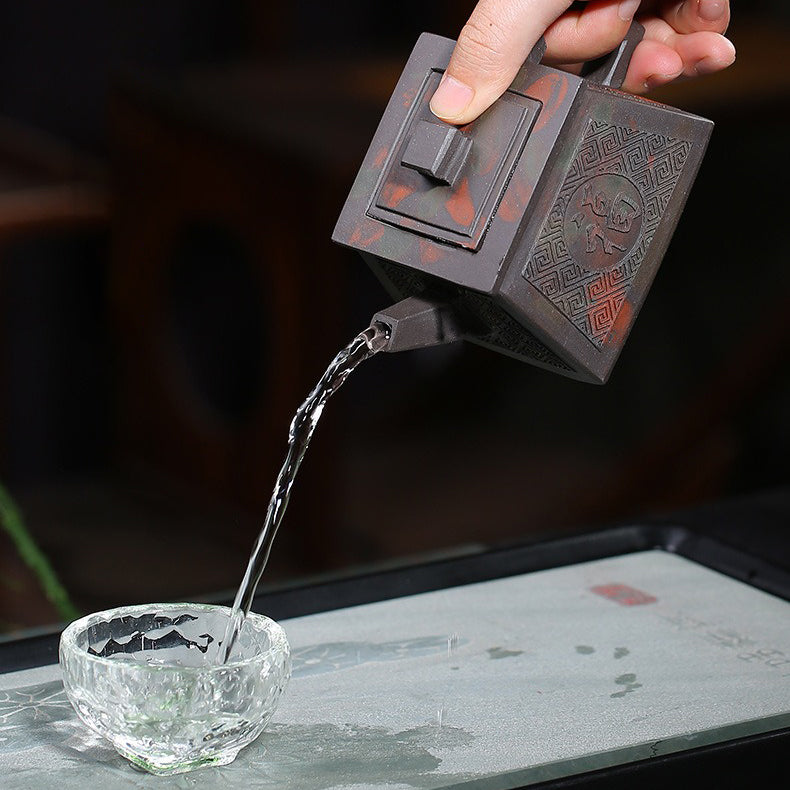 Close-up of the Yixing teapot spout, demonstrating smooth water-flow.