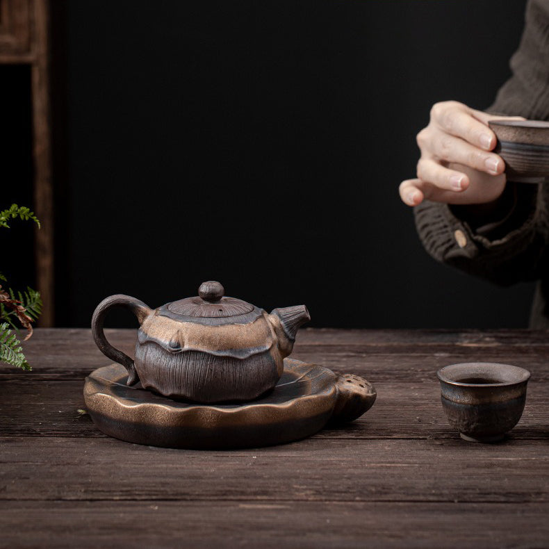 Elegant iron glazed teapot with lotus leaf design on base