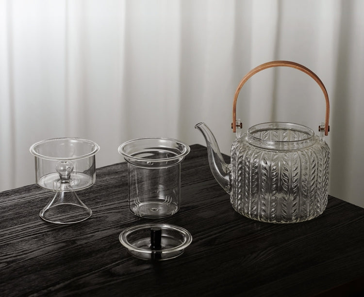 Elegant Japanese glass teapot showcasing the infusion of loose leaf tea.