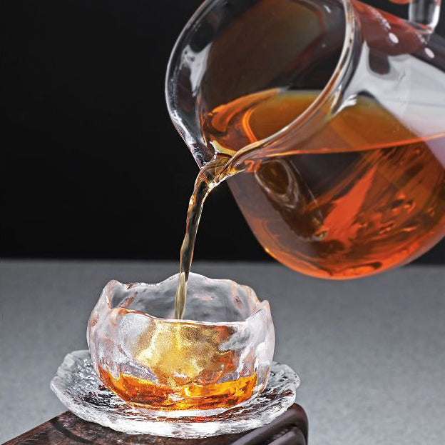 Aurora tea cup photographed mid-pour to showcase heat resistance and clarity.