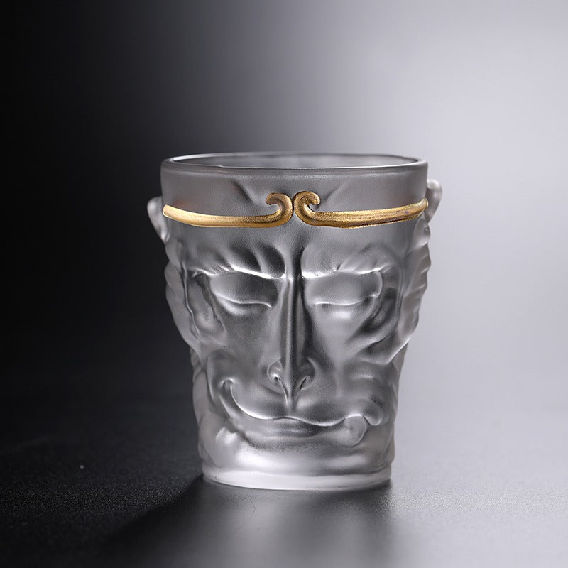 Close-up of the glass tea cup filled with freshly brewed tea, highlighting its artistic value.