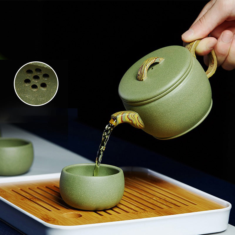 Tea set on a wooden tray, highlighting craftsmanship and natural materials