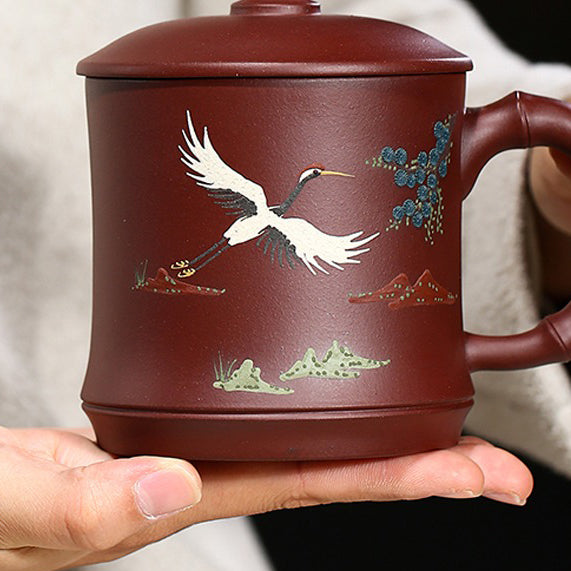 Top-down view of the purple clay teacup with crane and pine design, showcasing traditional chinese tea ware craftsmanship